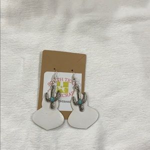 Woman white leather with cactus